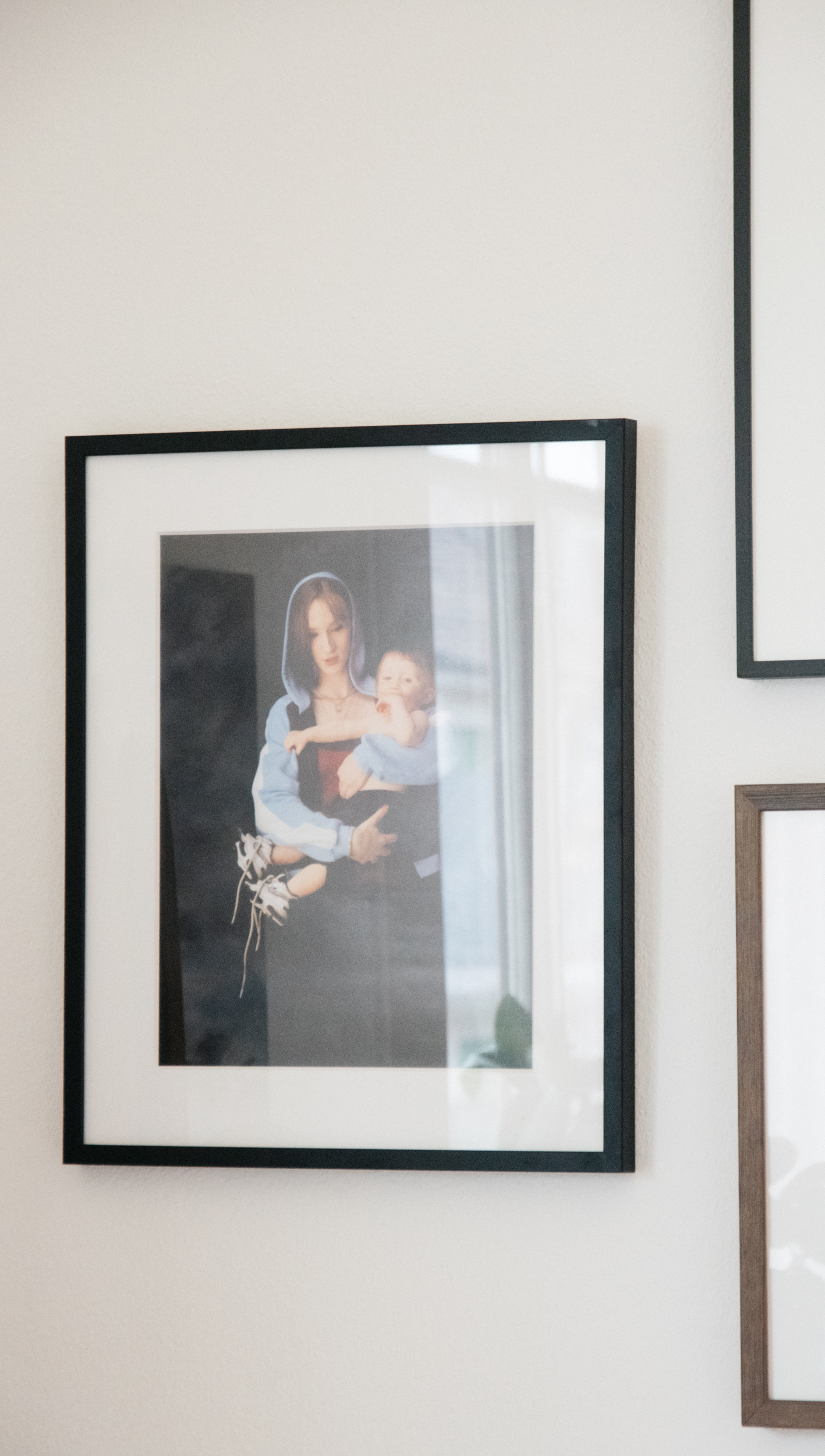 A shot of a photograph on Anne's wall depicting a young mother and child