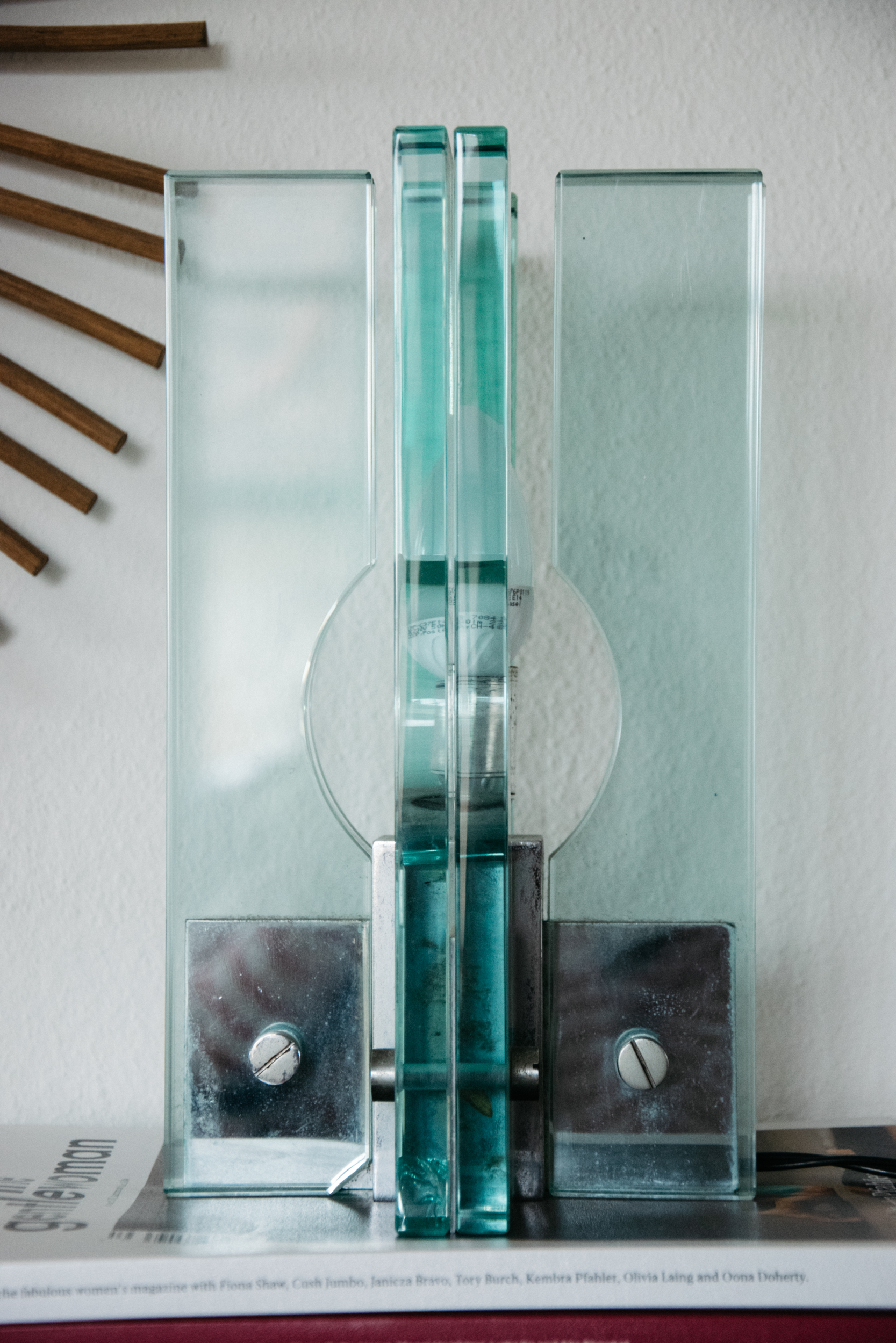 Close up of a vintage Italian glass lamp on top of the Gentlewoman magazine