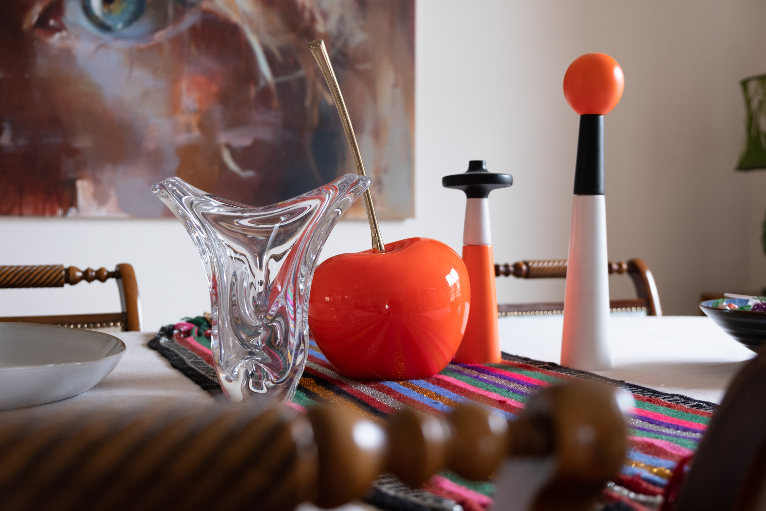 Anne's table, where she hosts private supper club dinners, decorated with an oversized cherry, from a Louis Vuitton window