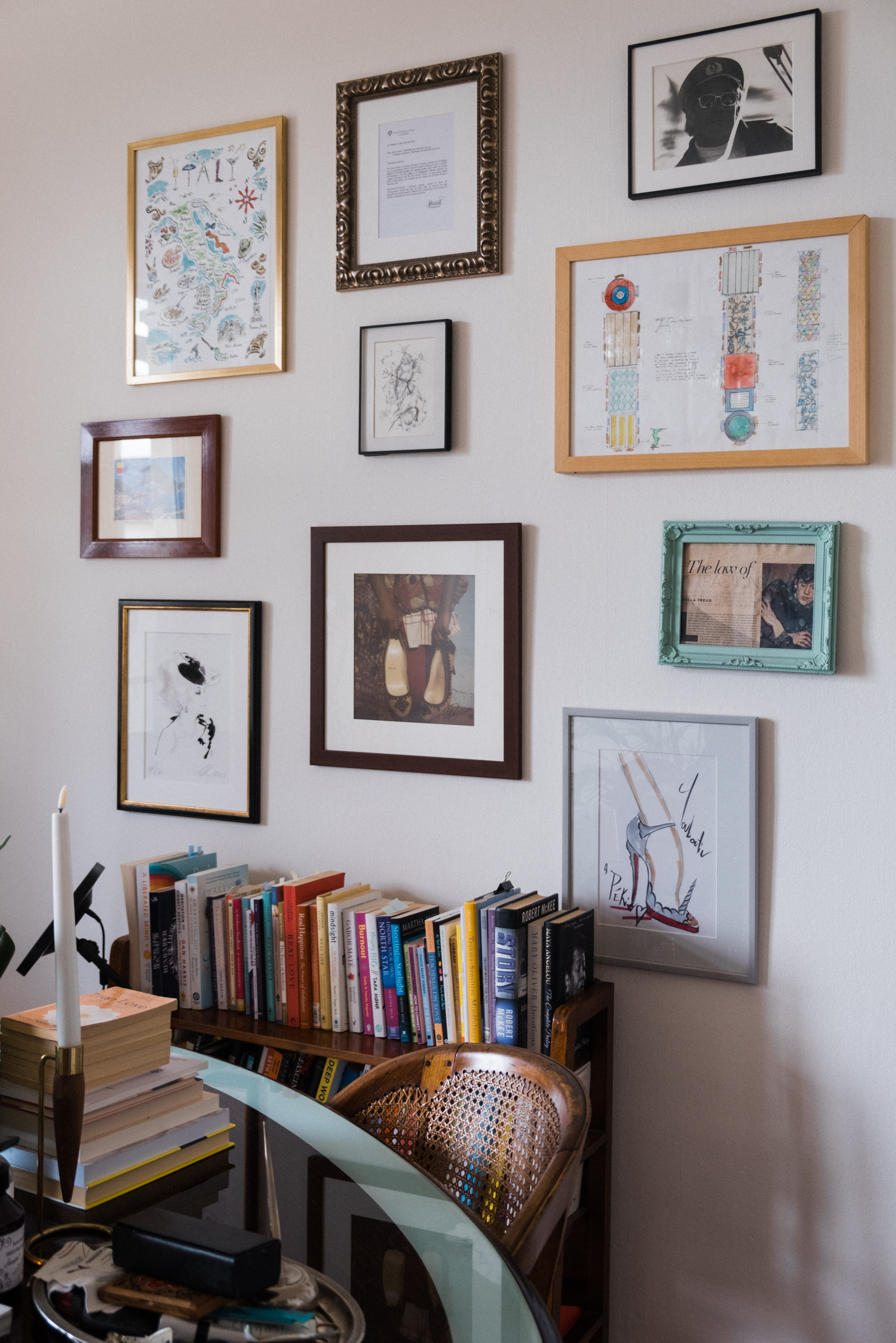 Multiple frames decorating a wall in Anne's office