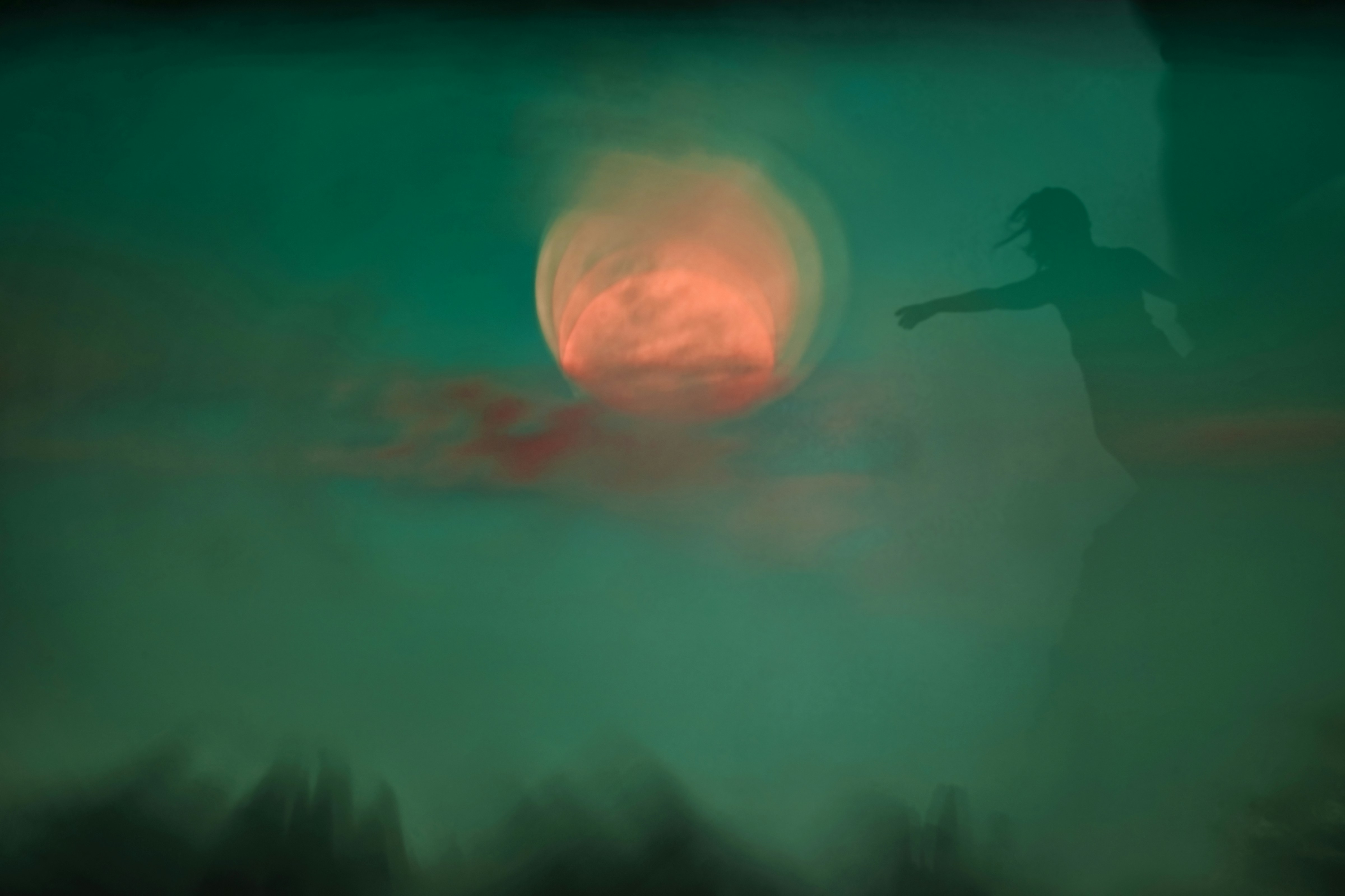 An image of a person reaching out to the moon, a dreamy image on a green background with orange mooon