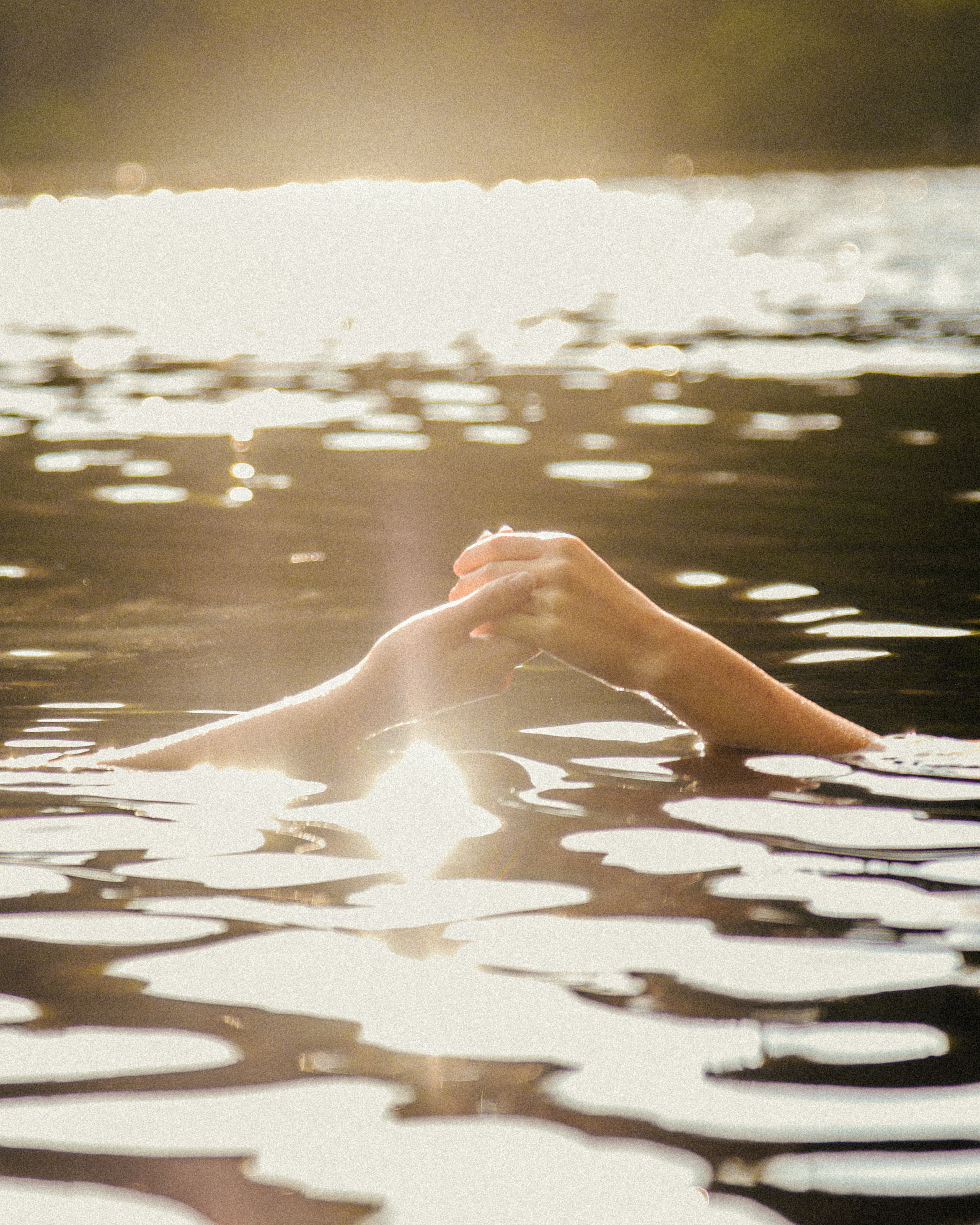 A photograph of two hands holding each other by Julia Astok