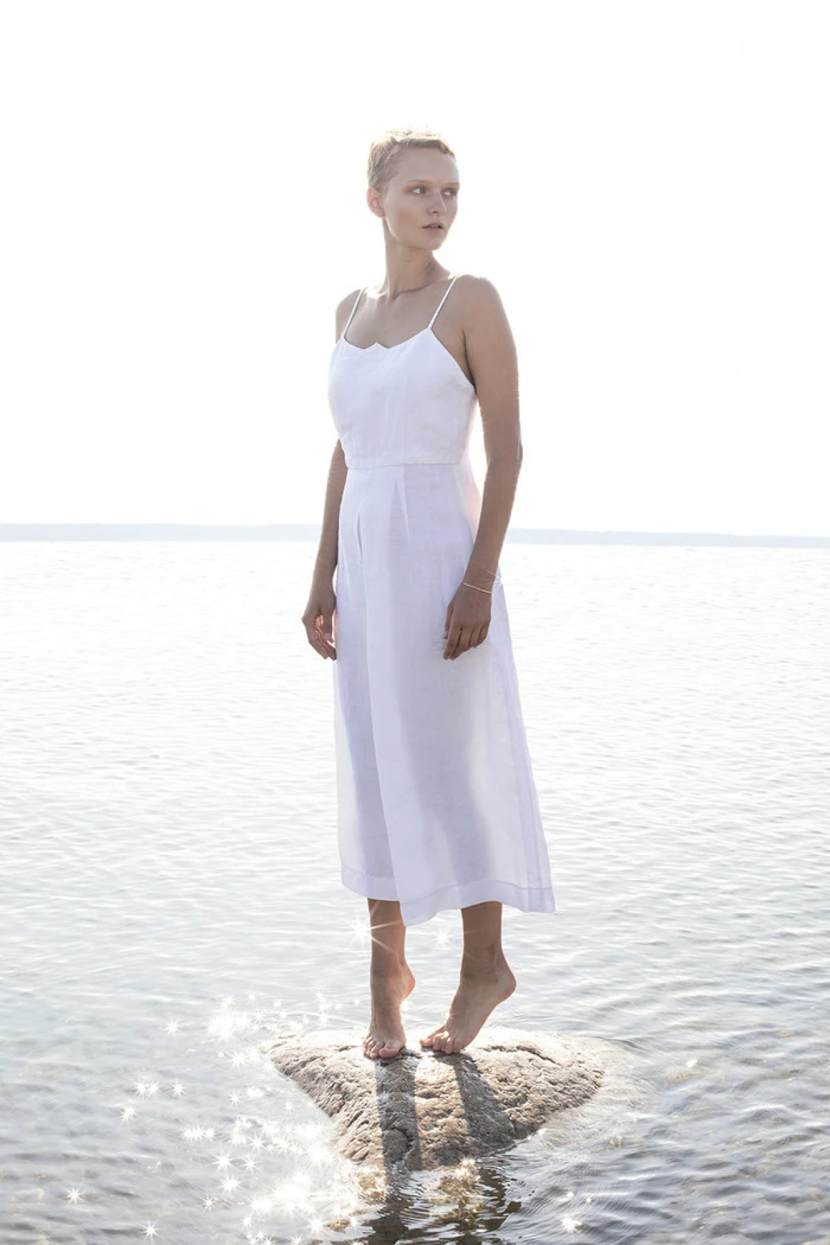 A white dressed of Hanna Fiedler collection modeled for the lookbook