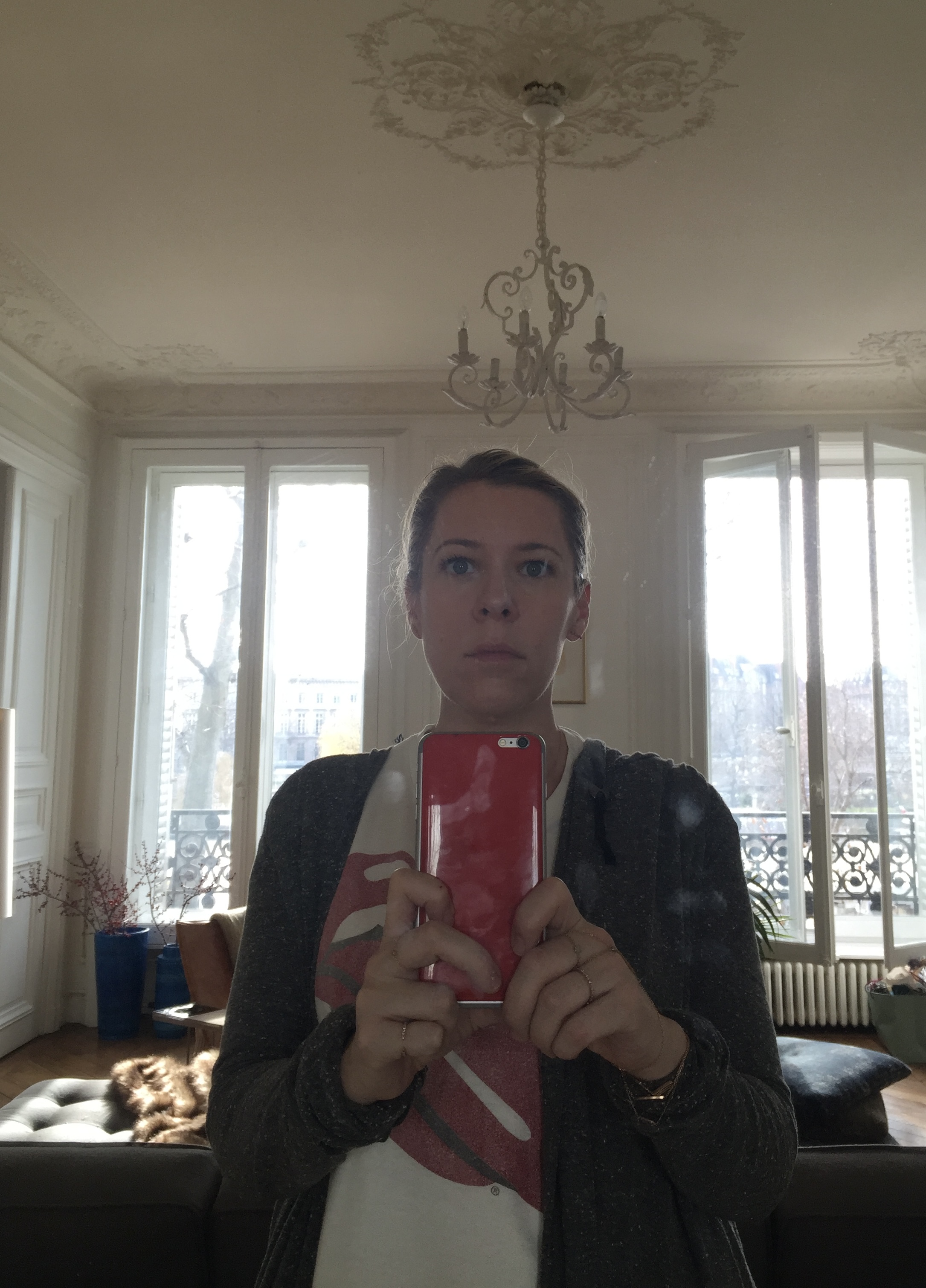 Anne Muhlethaler taking a mirror selfie in her Paris appartment