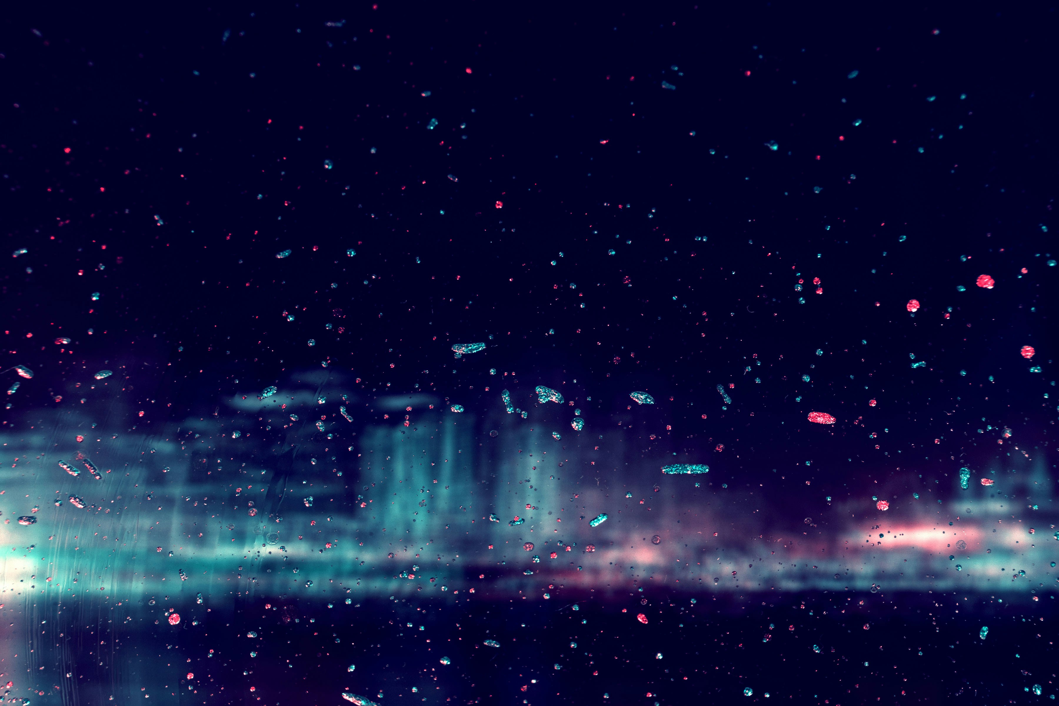 Drops reflected on a car window at night