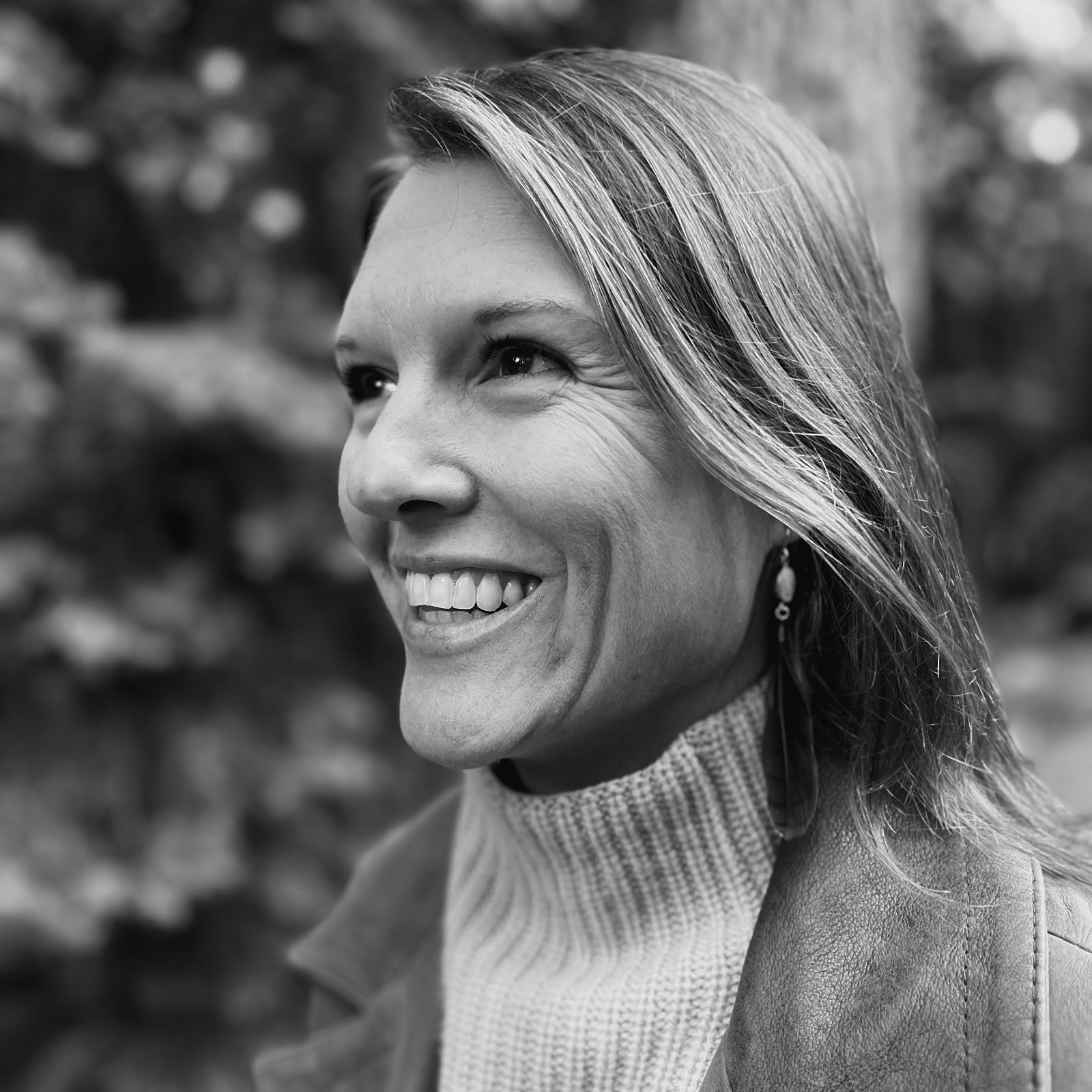 A black and white profile portrait of Libby Stockstill, CEO and founder of Some Days